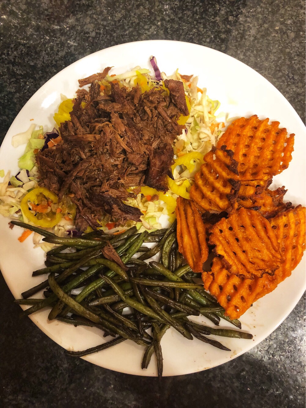 Shredded Italian beef over slaw with green beans and sweet potato waffle fries.