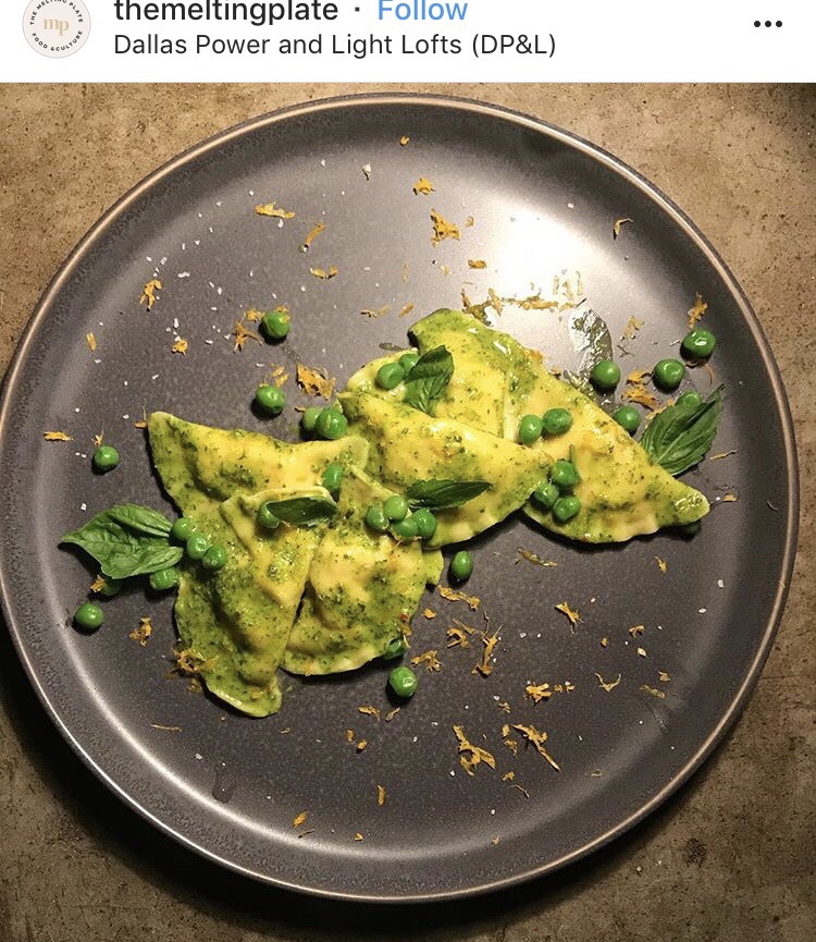 An Instagram post from themeltingplate at Dallas Power and Lofts. It shows raviolis and peas and on a gray plate.