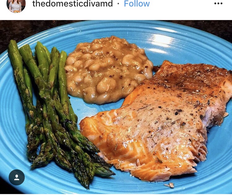 An Instagram post from thedomesticdivamd featuring asparagus, beans, and salmon.