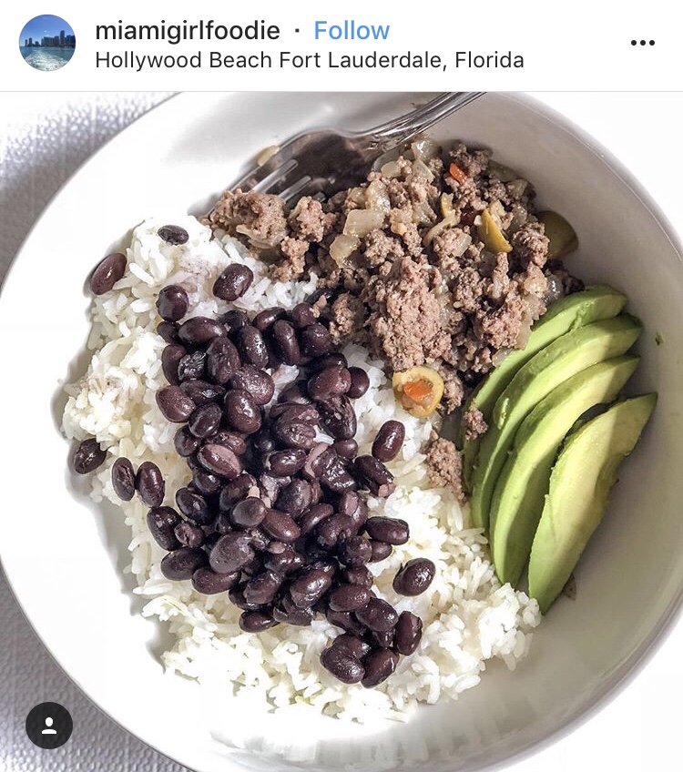 An Instagram post from miamigirlfoodie in Hollywood Beach Fort Laurdale, Florida. It features ground meat, avocado, rice, and beans. 