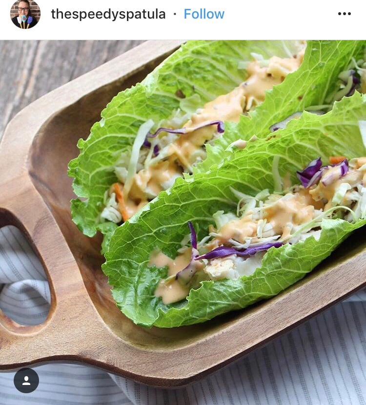 An Instagram post from thespeedyspatula featuring lettuce wrapped fish tacos with sauce and slaw.
