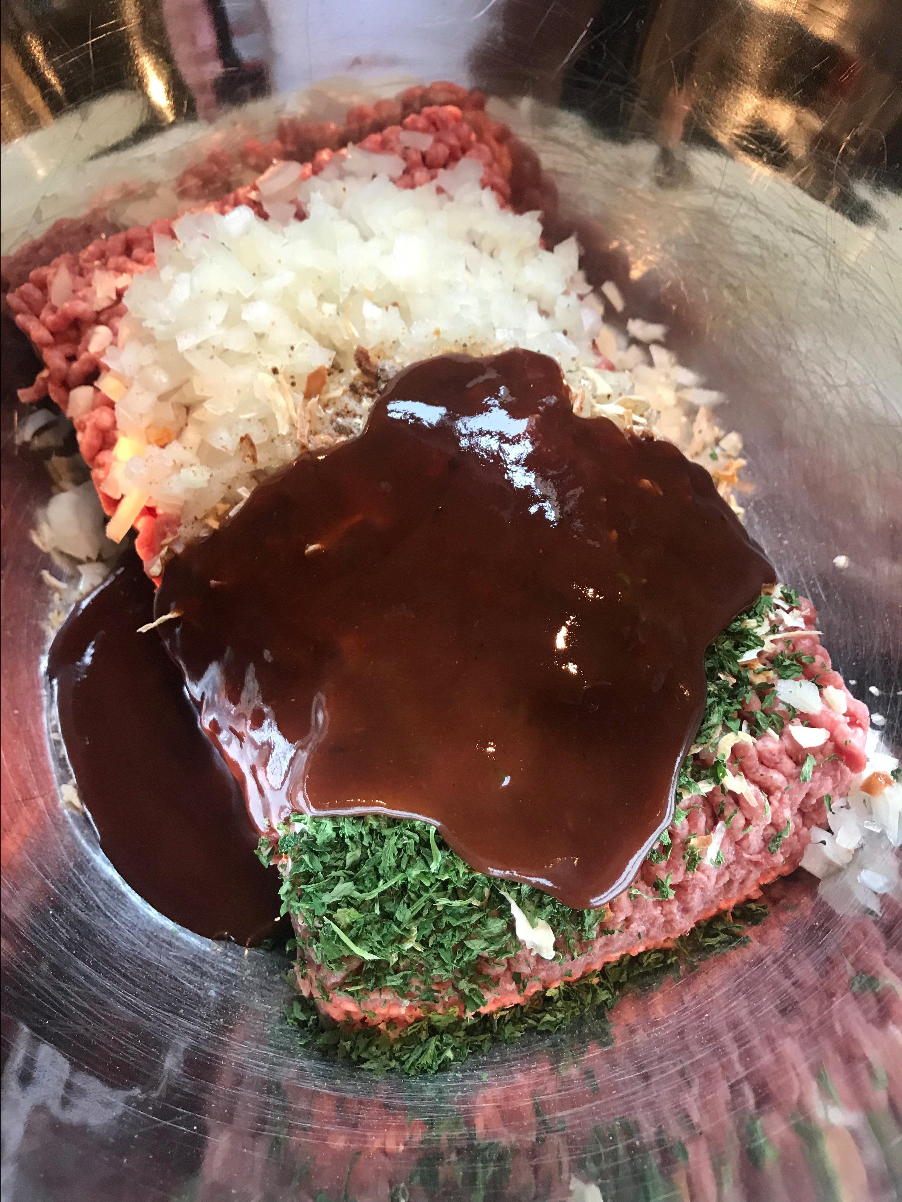 The ingredients for the pot roast in a metal bowl