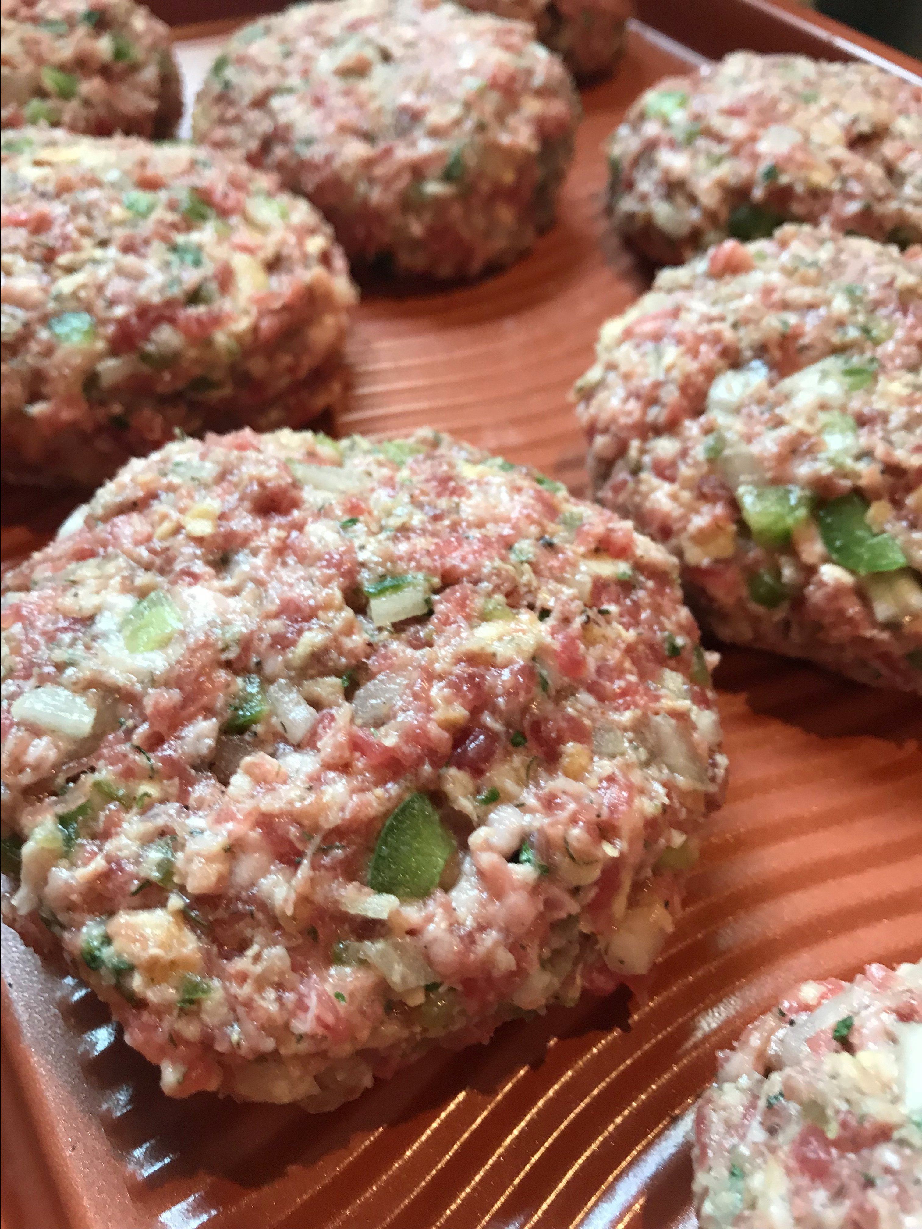 The meat mixture formed into burger shapes