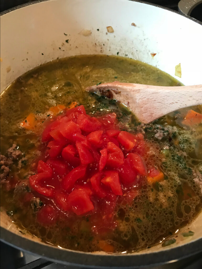 Diced tomato added to the soup