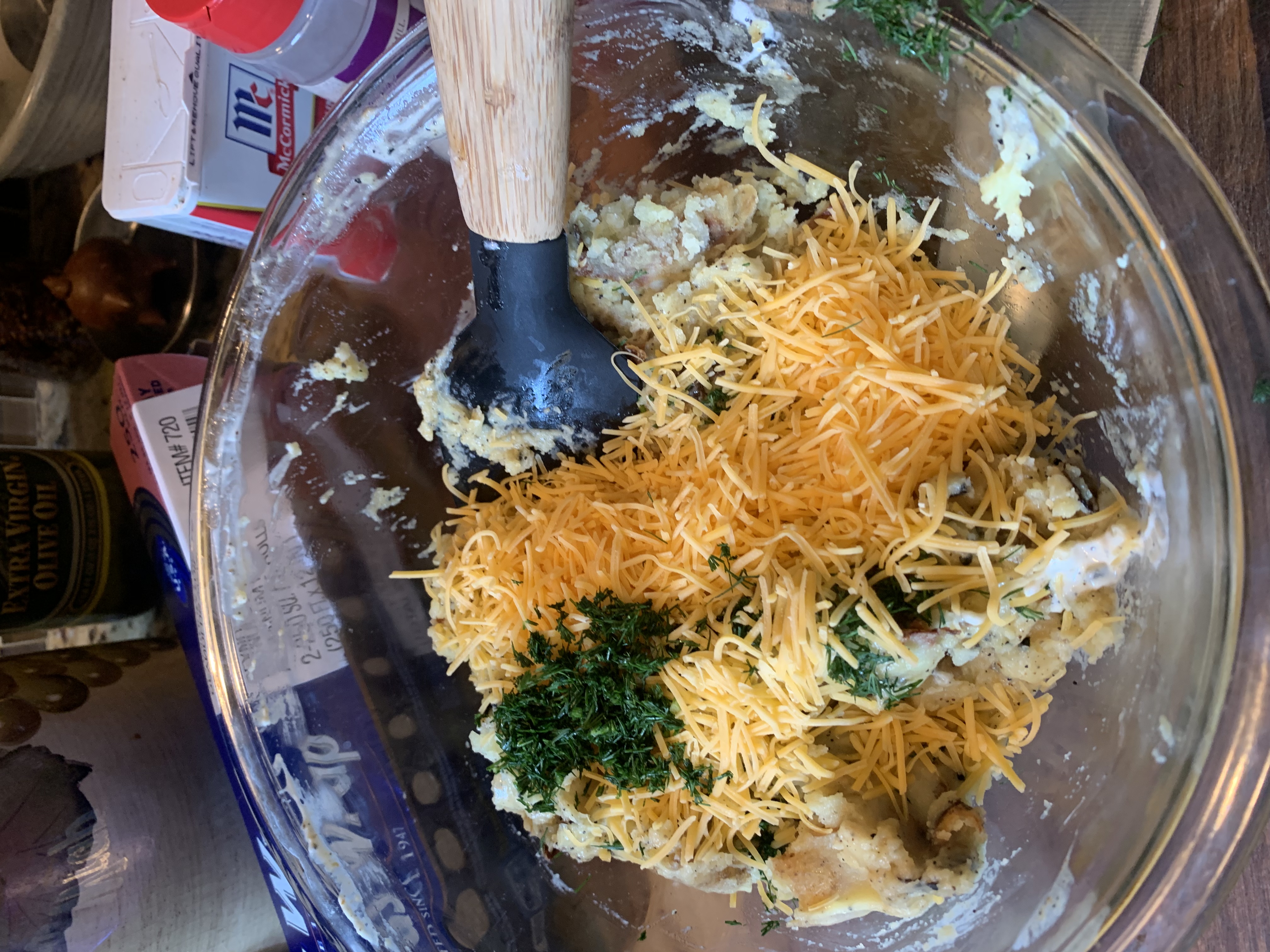 A bowl of mashed potatoes with mayo, butter, mayo, and cheese