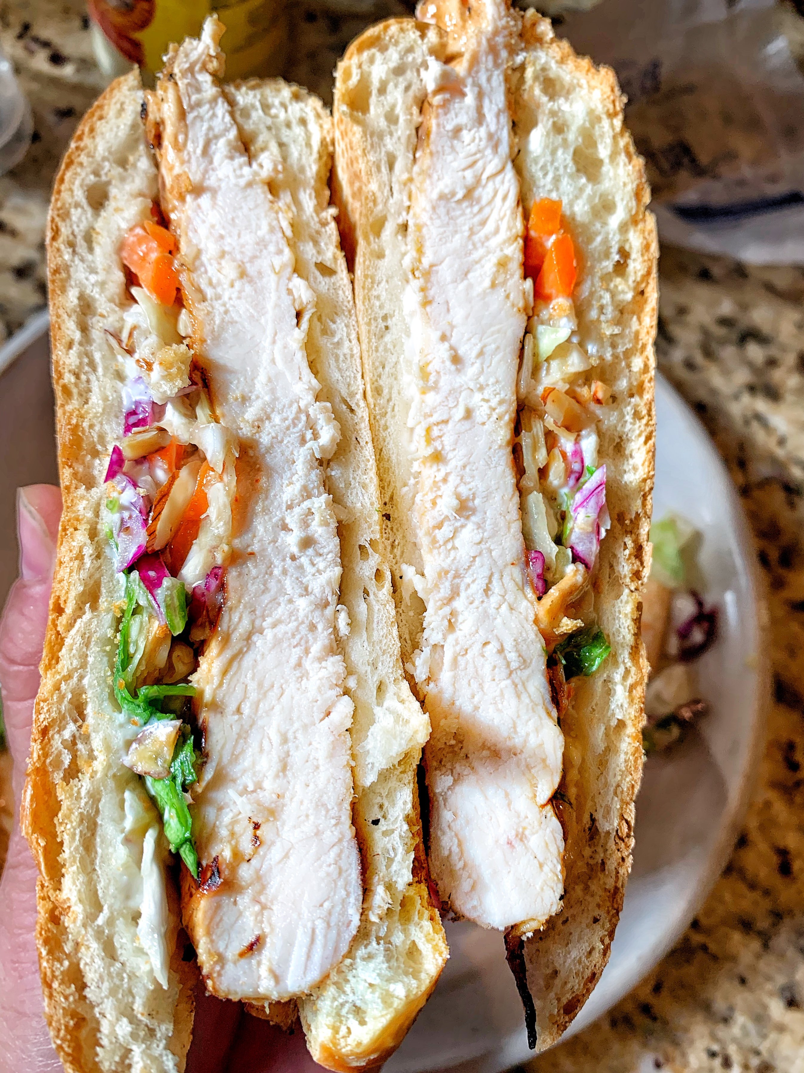 Picture of two sandwich halves showing chicken and slaw