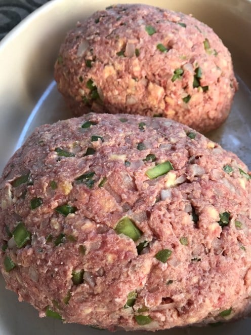 Meatloaf with onion, green pepper, and saltine crackers before being cooked