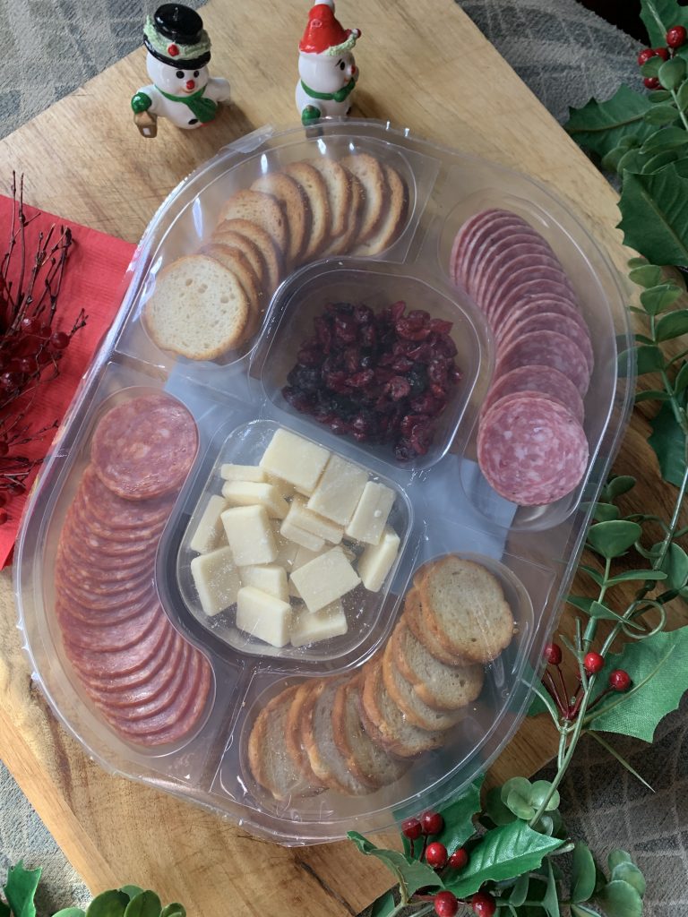 The Hillshire Snacking Platter featuring salami, bread chips, cheese, and craisins