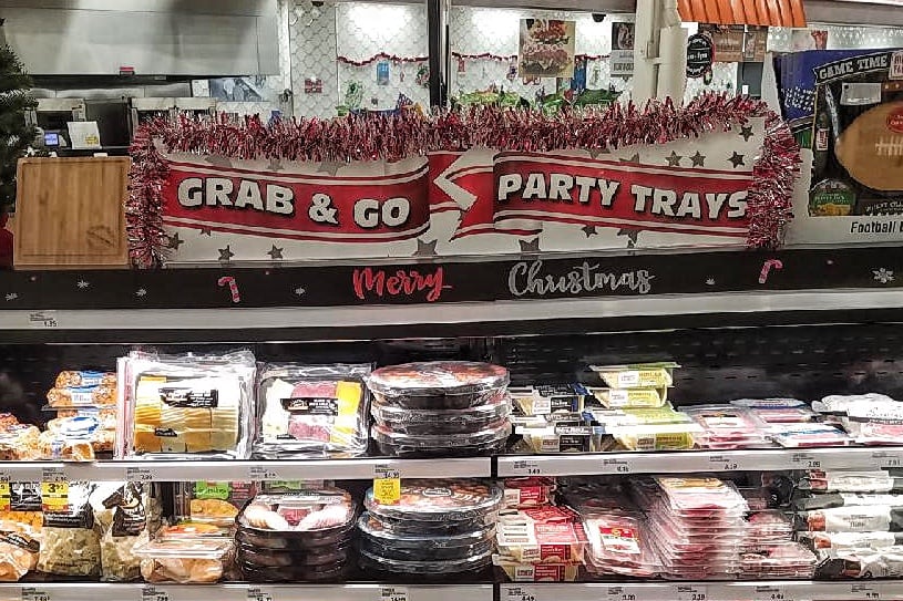 An aisle with party trays in the supermarket