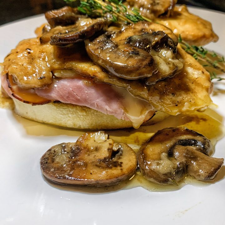 An easy chicken dinner made with cheese, ham, bread dumplings, and mushroom