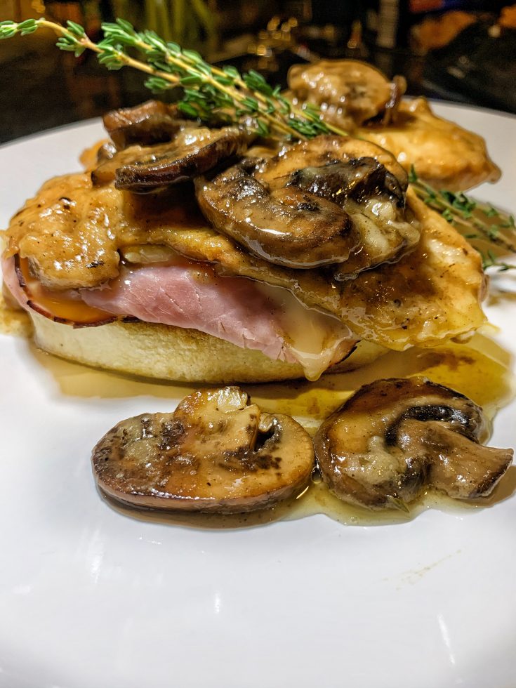 An easy chicken dinner made with cheese, ham, bread dumplings, and mushroom