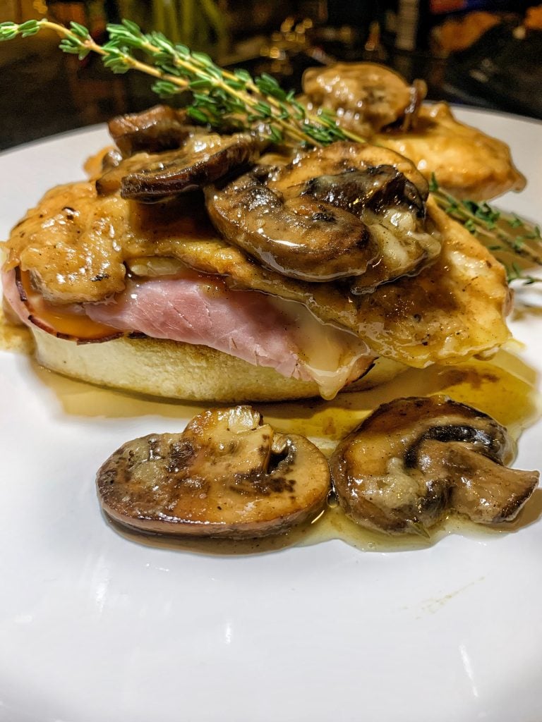 An easy chicken dinner made with cheese, ham, bread dumplings, and mushroom