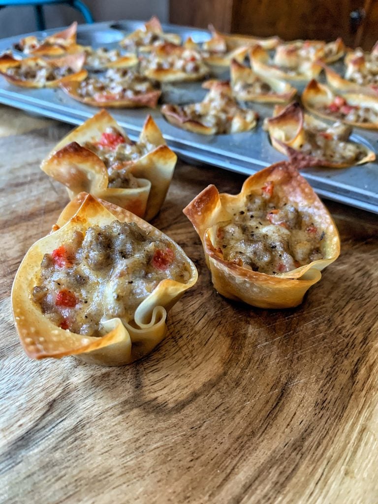 Sausage and cheese in a fried wonton wrapper