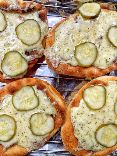 The flat breads with the melted havarti and pickle chicps on top