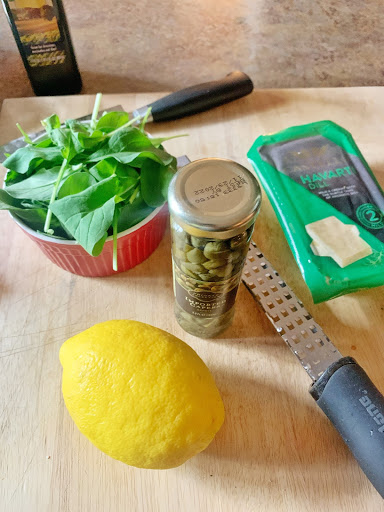 Lemon, a zester, capers, arugala, and a package of Havarti Dill Cheese