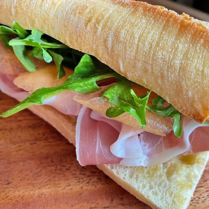 Prosciutto, arugula and cantaloup on a toasted baguette with butter