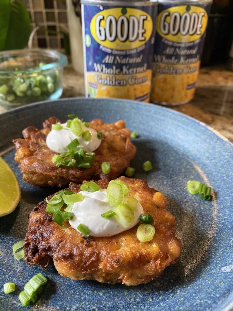 Cheesy corn fritters with sour cream and green onions