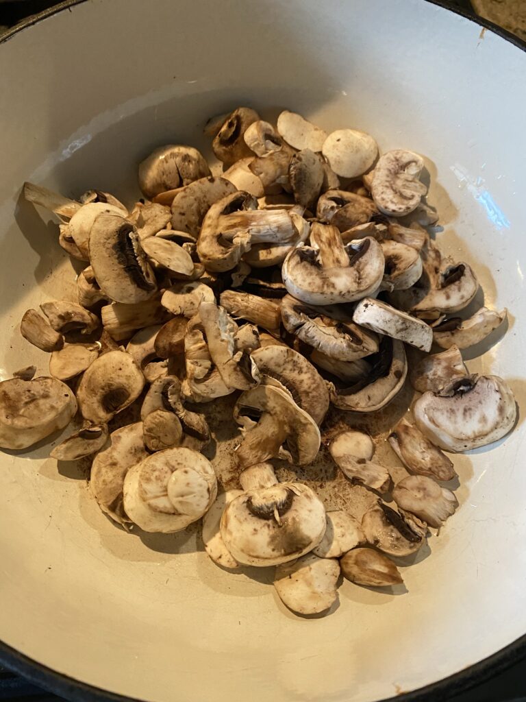 Sliced mushrooms in a pan