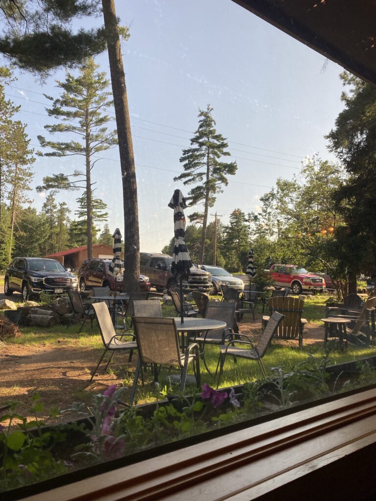 The outdoor area of the Twilight Supper Cub, featuring outdoor tables and chairs