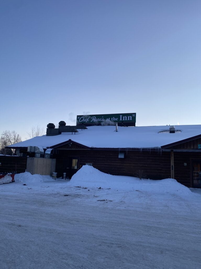 The exterior of Chef Rene's restaurant, covered in snow