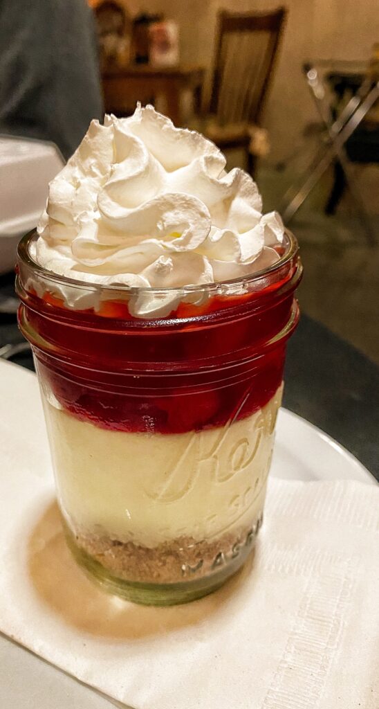 A cherry cheesecake parfait