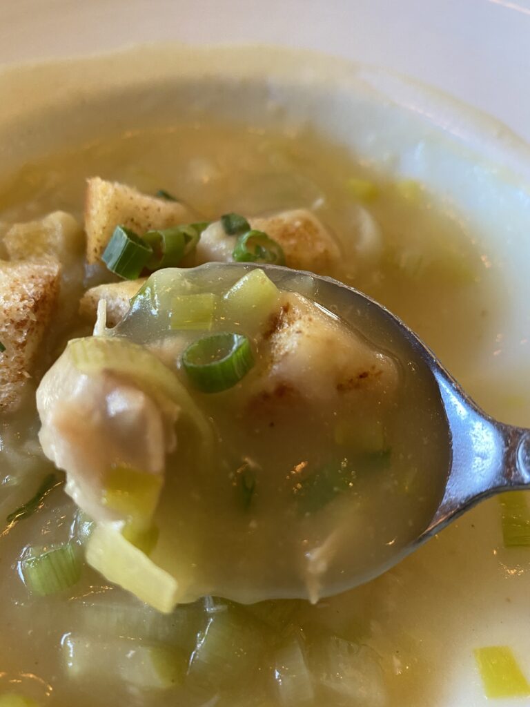 A spoonful of creamy leek potato soup