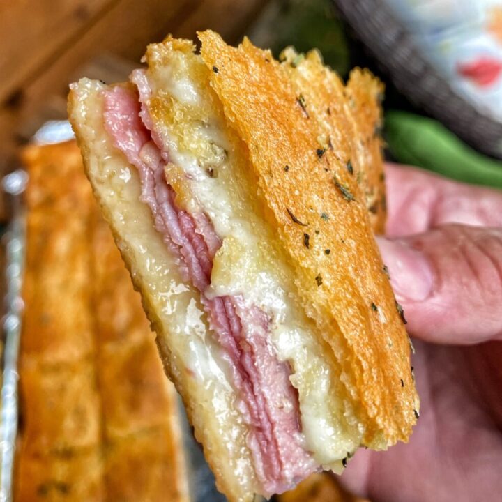 A close up of a ham and cheese square