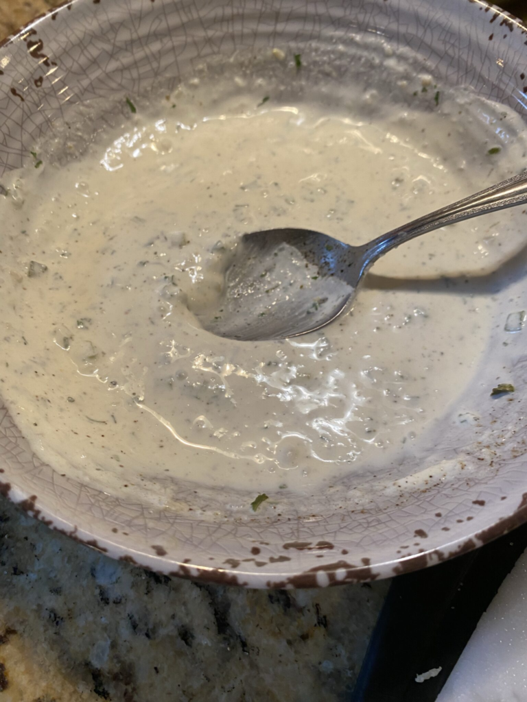 Homemade horseradish cream sauce made with sour cream, prepared horseradish, and seasonings.