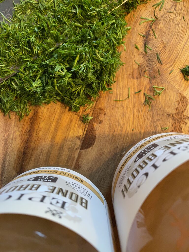 Herbs and jars of bone broth