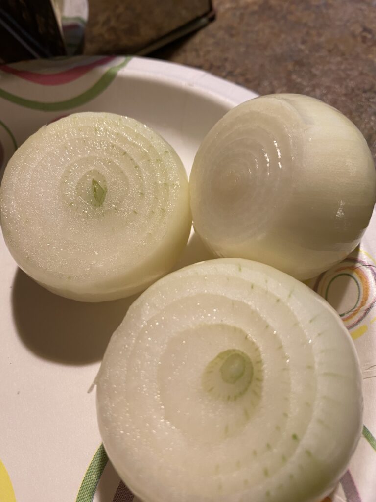 Three onions with the top sliced off