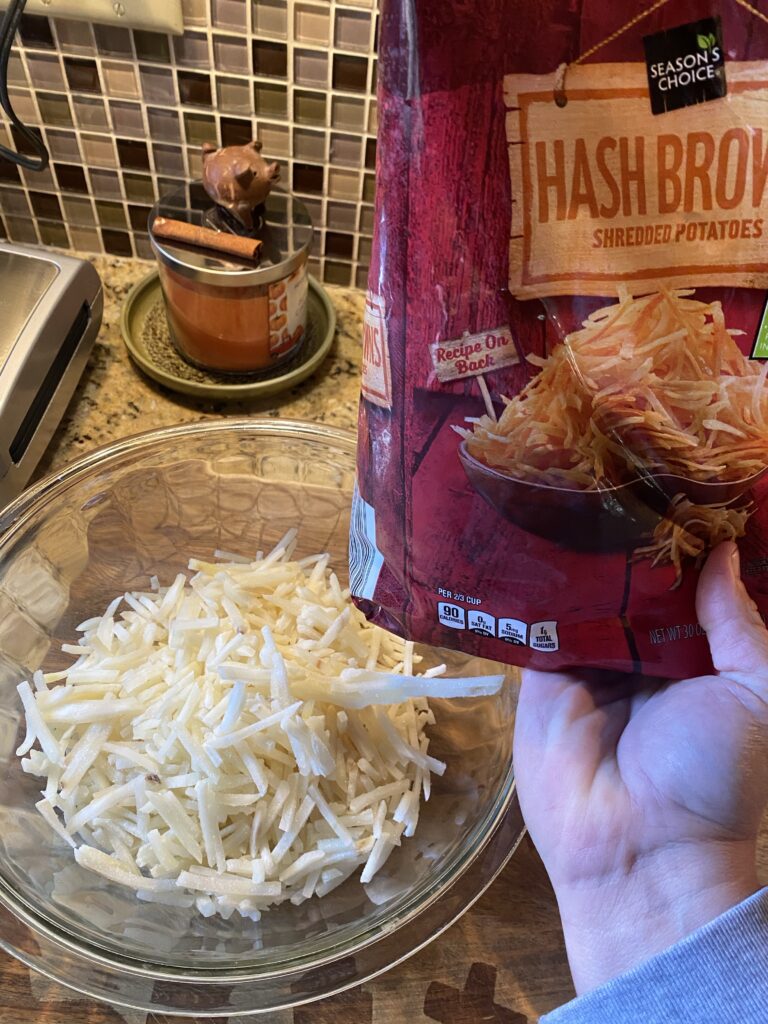 A bowl of frozen hash browns next to a package of frozen hash browns