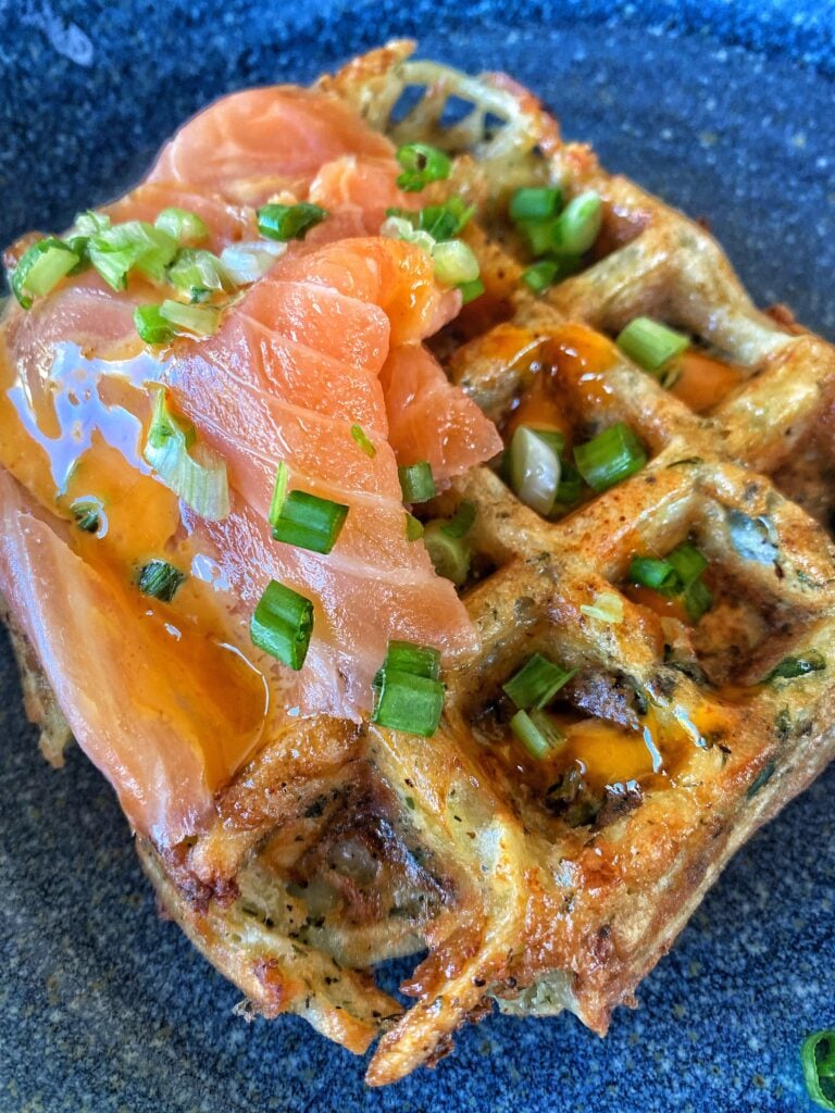 A potato waffle topped with smoked salmon