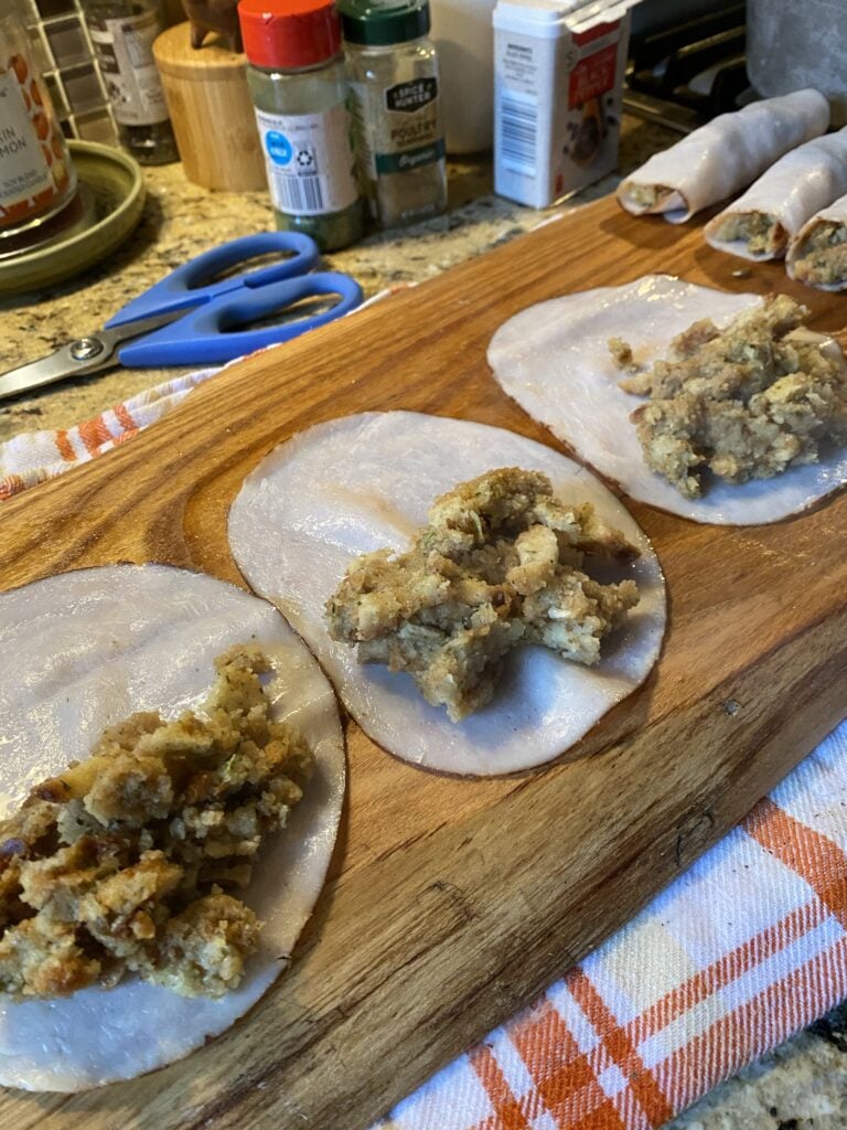 Slices of deli turkey with stuffing on top