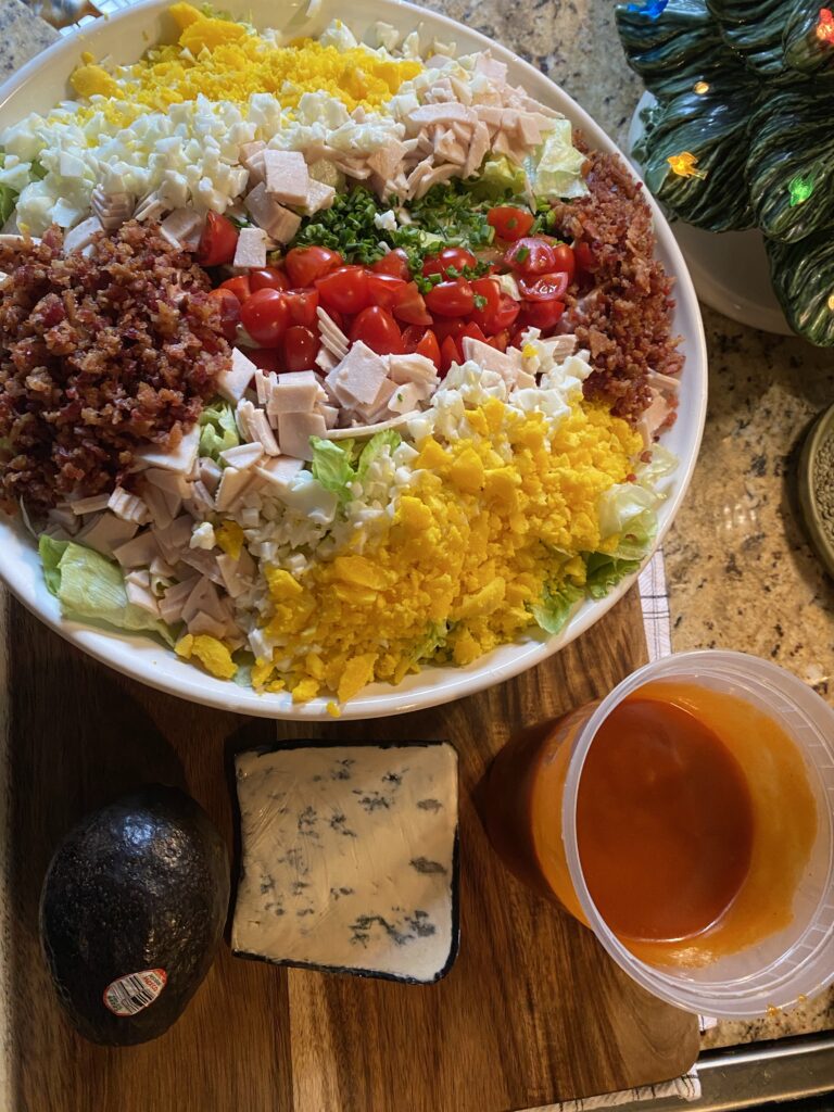 Cobb salad with French dressing and blue cheese seen from abovec