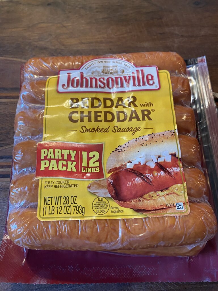 A package of Johnsonville "Beddar with Cheddar" smoked sausage