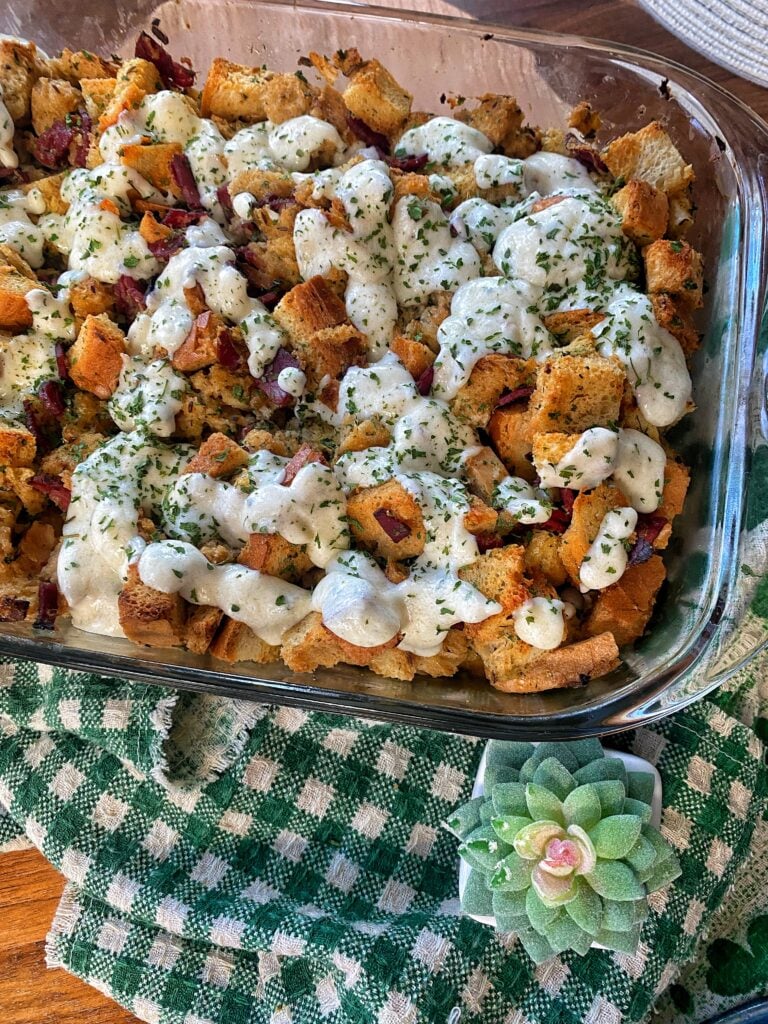 A close up of Corned Beef Breakfast Bake with Swiss Cheese Sauce