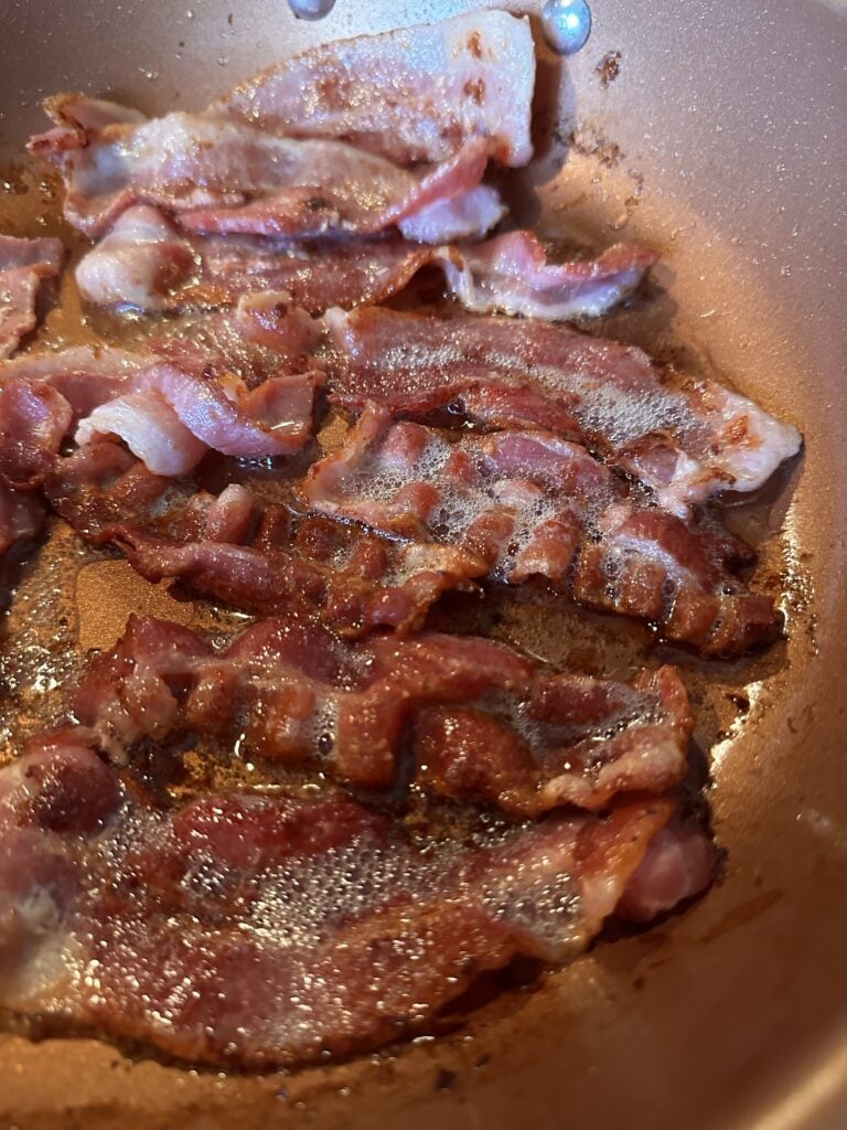 Bacon sizzling in a pan