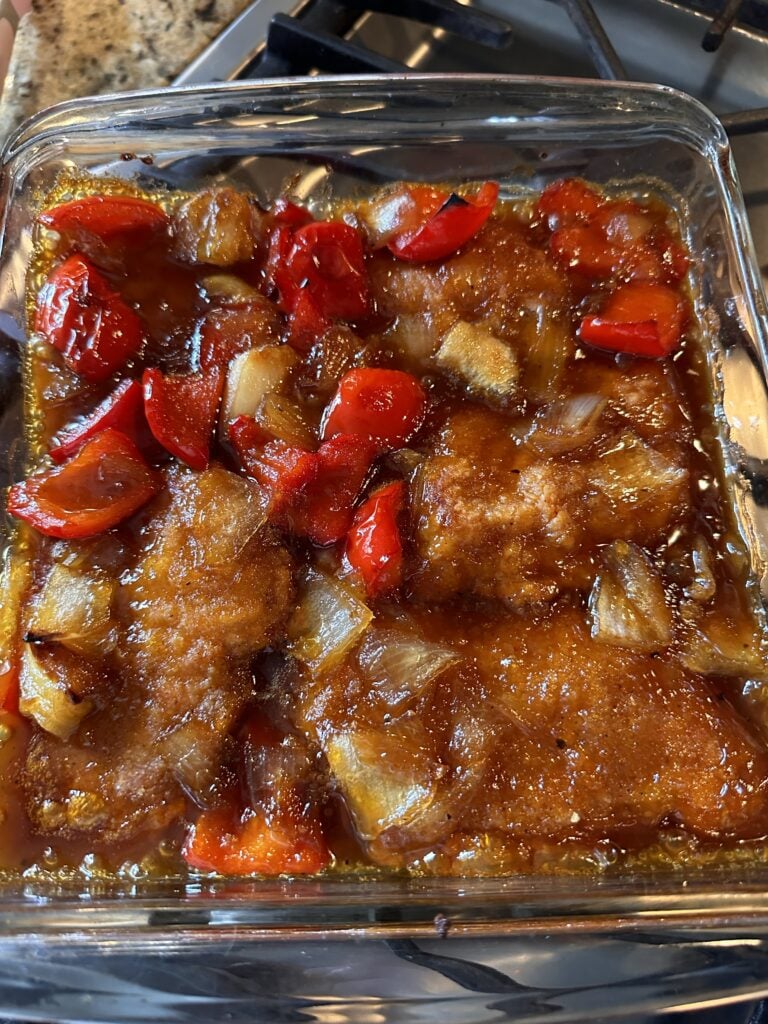 Sweet and sour chicken on a glass baking dish