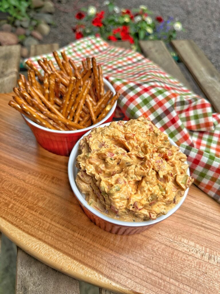 Bourbon Brown Sugar Cheese Pretzel Dip in front of pretzel sticks