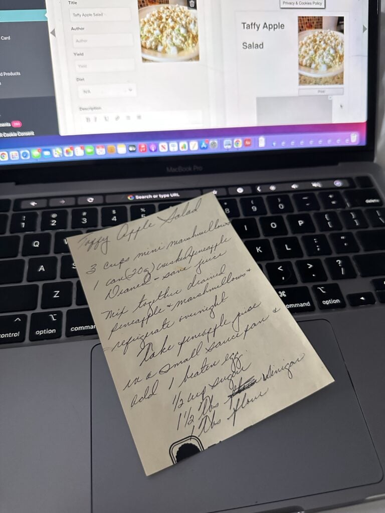 A post-it note with the Taffy Apple Salad recipe on a laptop that has the recipe card for this article open
