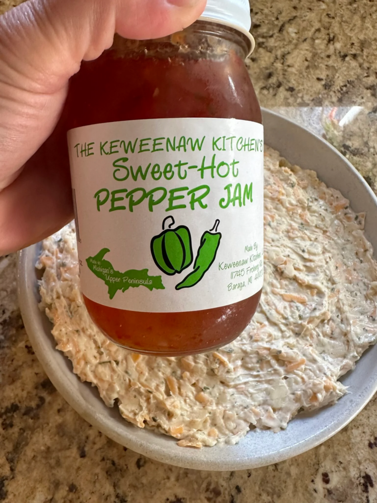 Sweet hot pepper jelly used to top creamy Pepper Jelly Cheese Dip