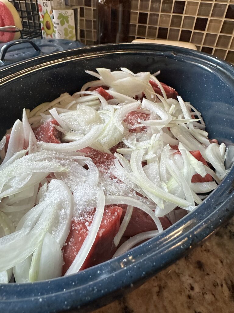 Onions and sat over raw beef in the speckled roaster