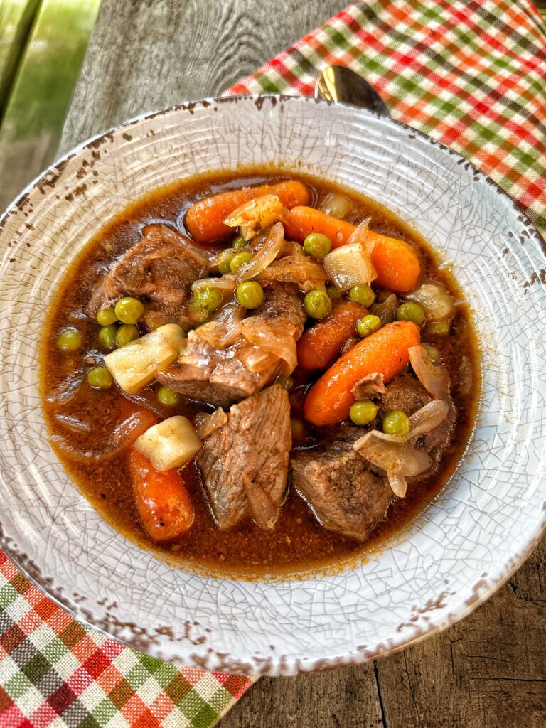 A bowl of classic beef stew, seen from above