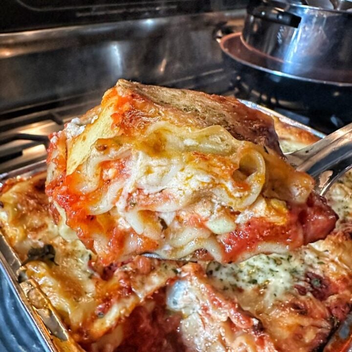 A slice of Classic Lasagna being lifted out of the dish