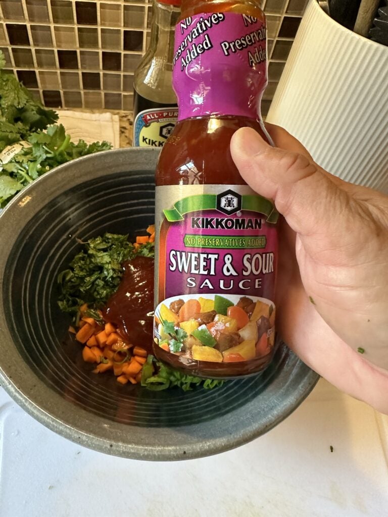 A bottle of Kikkonman Sweet and Sour Sauce