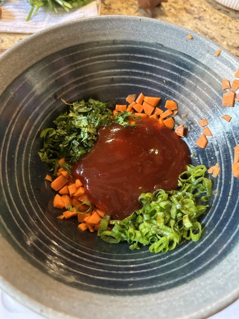 Chopped veggies topped with sweet and sour sauce