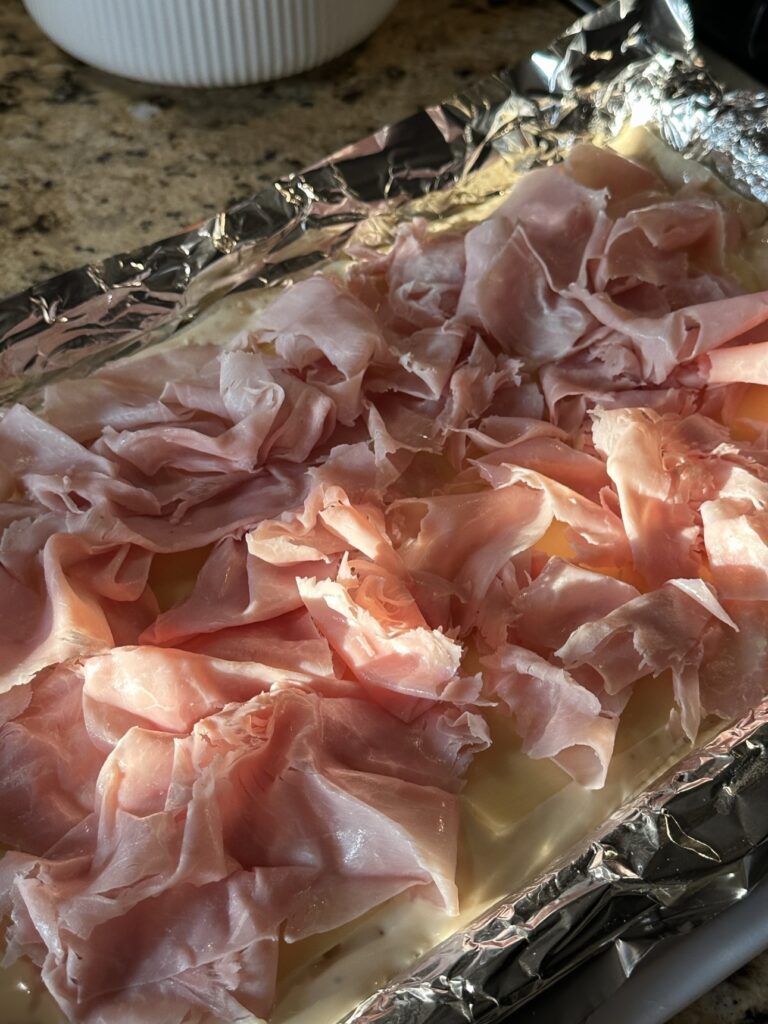 Deli ham over pastry dough