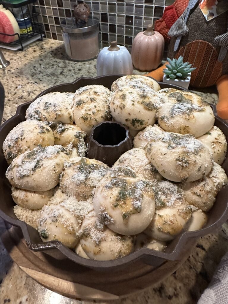 Buttery rolls in a baking tin before being cooked
