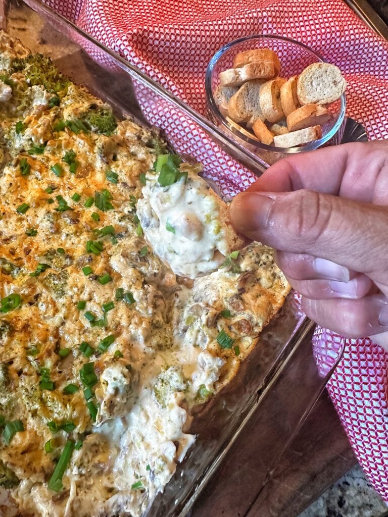 Creamy Broccoli Cheese Dip on a cracker