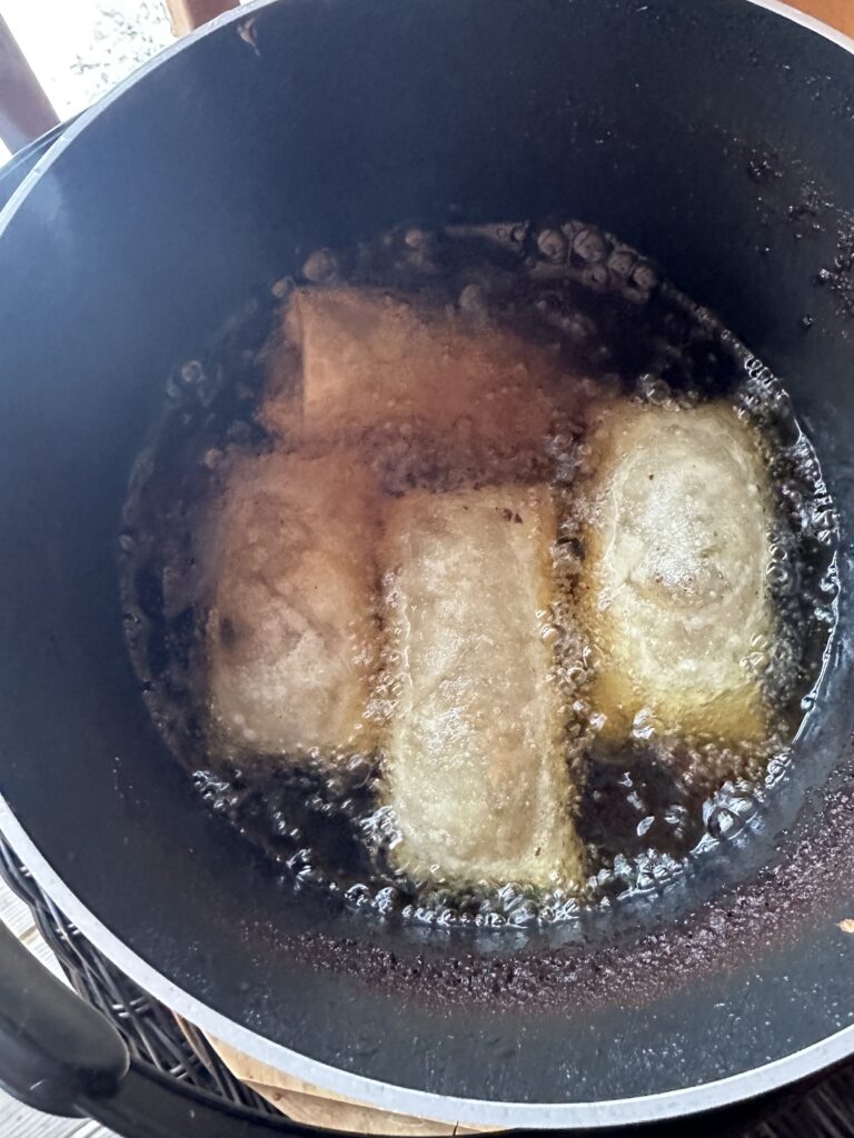 Egg rolls frying